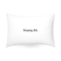 White pillow with the phrase 'Sleeping, Brb.' modern design, perfect for bedroom decor.