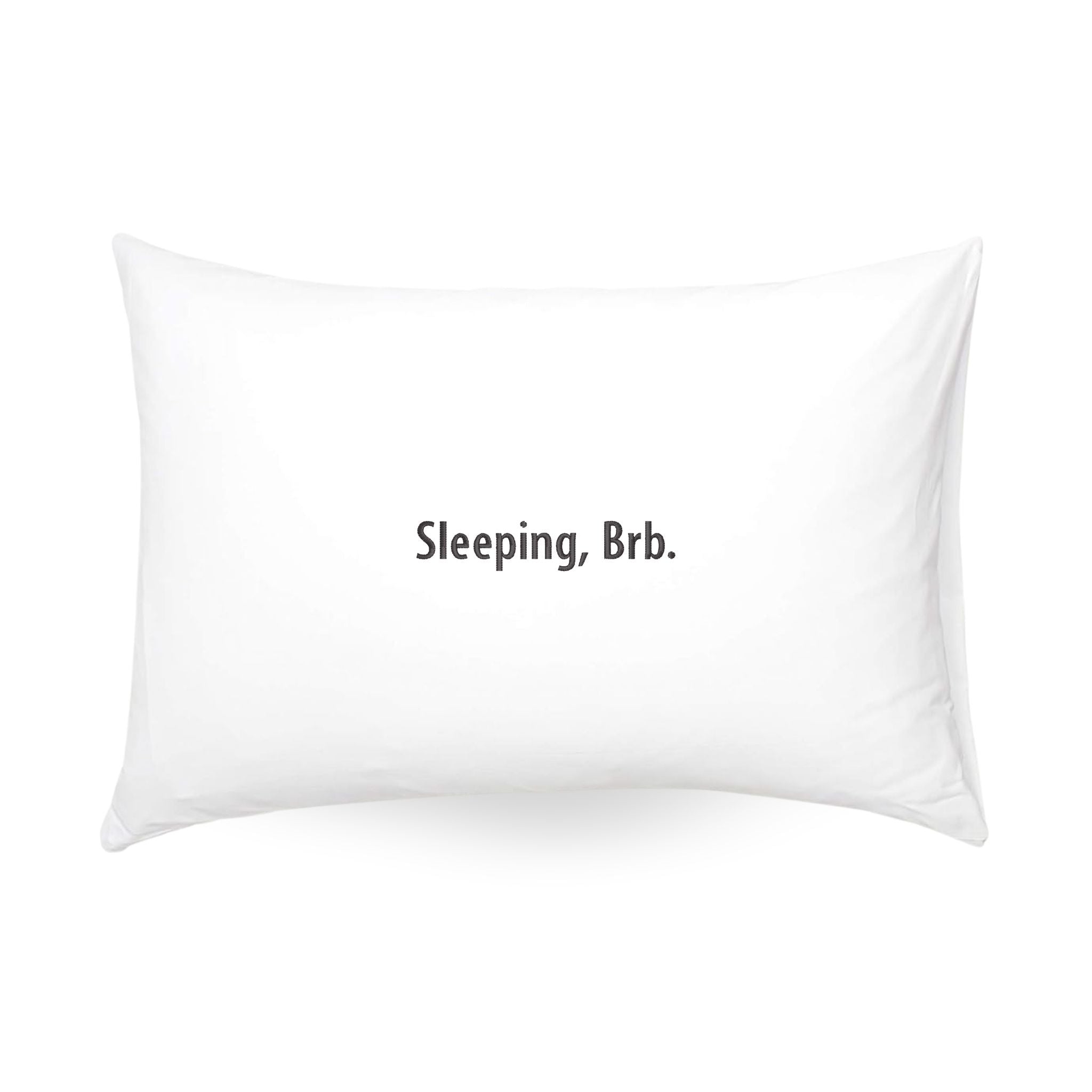 White pillow with the phrase 'Sleeping, Brb.' modern design, perfect for bedroom decor.