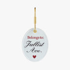 Personalized embroidered keychain in white with red lettering and gold ring.
