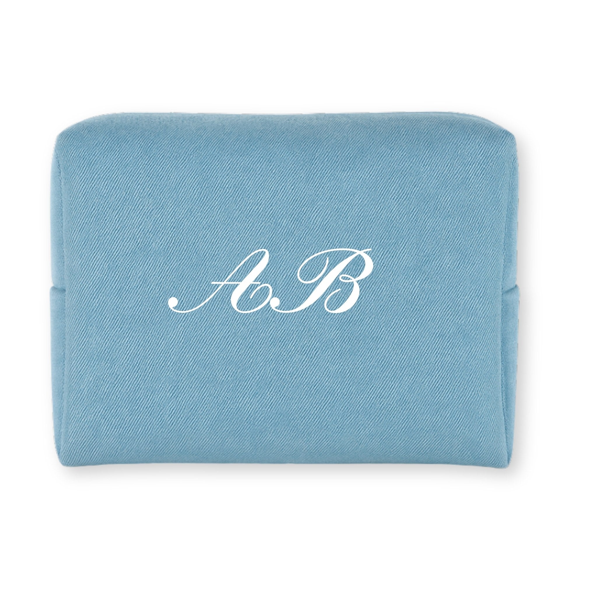 Personalized blue cosmetic pouch made of durable fabric with elegant white initials A.B.