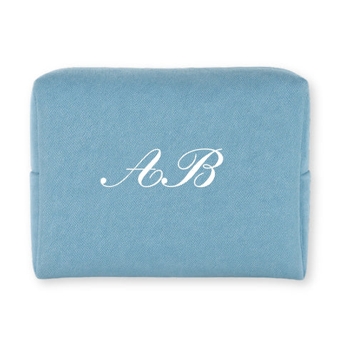 Personalized blue cosmetic pouch made of durable fabric with elegant white initials A.B.