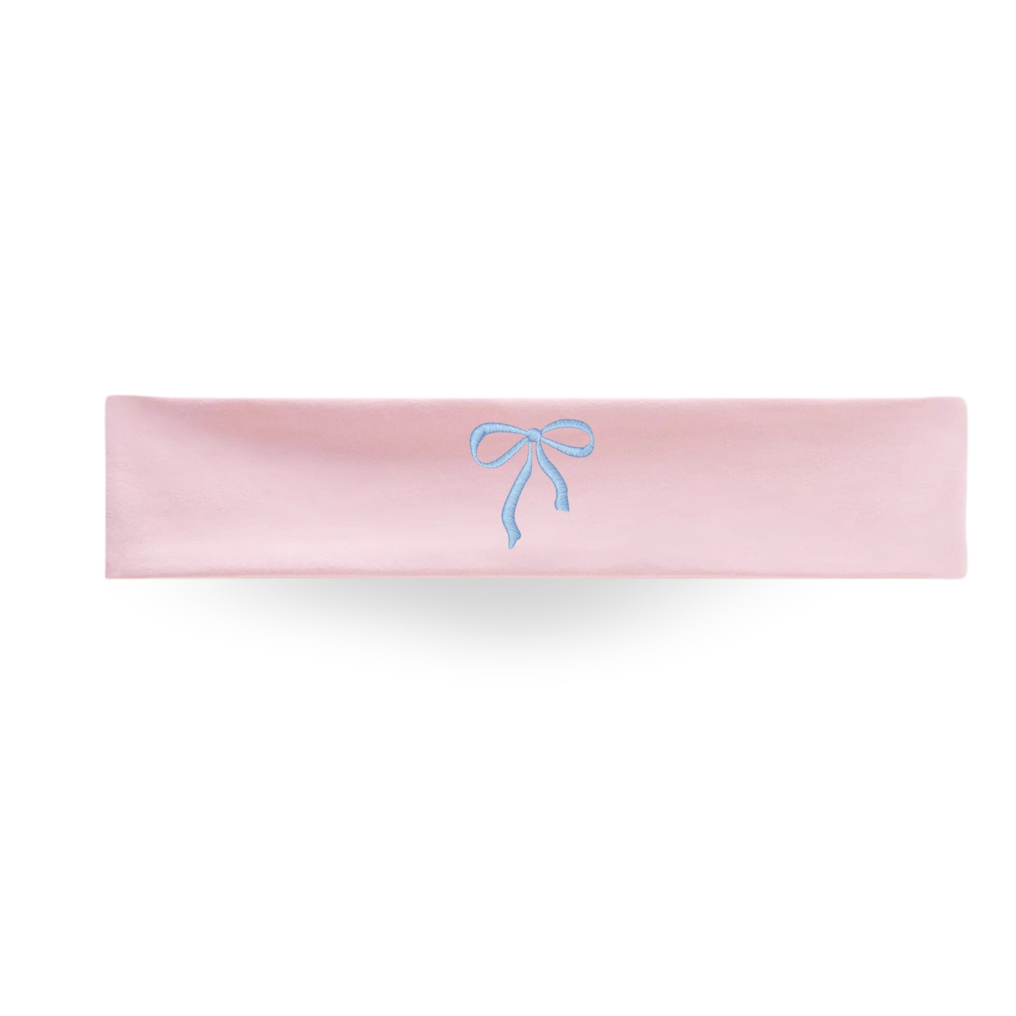 Soft pink headband with blue embroidered bow, perfect for casual or dressy occasions.