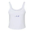 Women's white tank top featuring blue embroidered initials A.B., made from soft cotton blend.