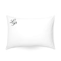 Luxury white pillow with black embroidered initials 'Lp', soft cotton blend for ultimate comfort.