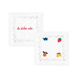 Embroidered white napkins with fruit designs and 'la dolce vita' text, perfect for stylish dining.