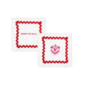 Festive white napkin with red trim and cake design; embroidered with 'love you' and 'another year hotter'.