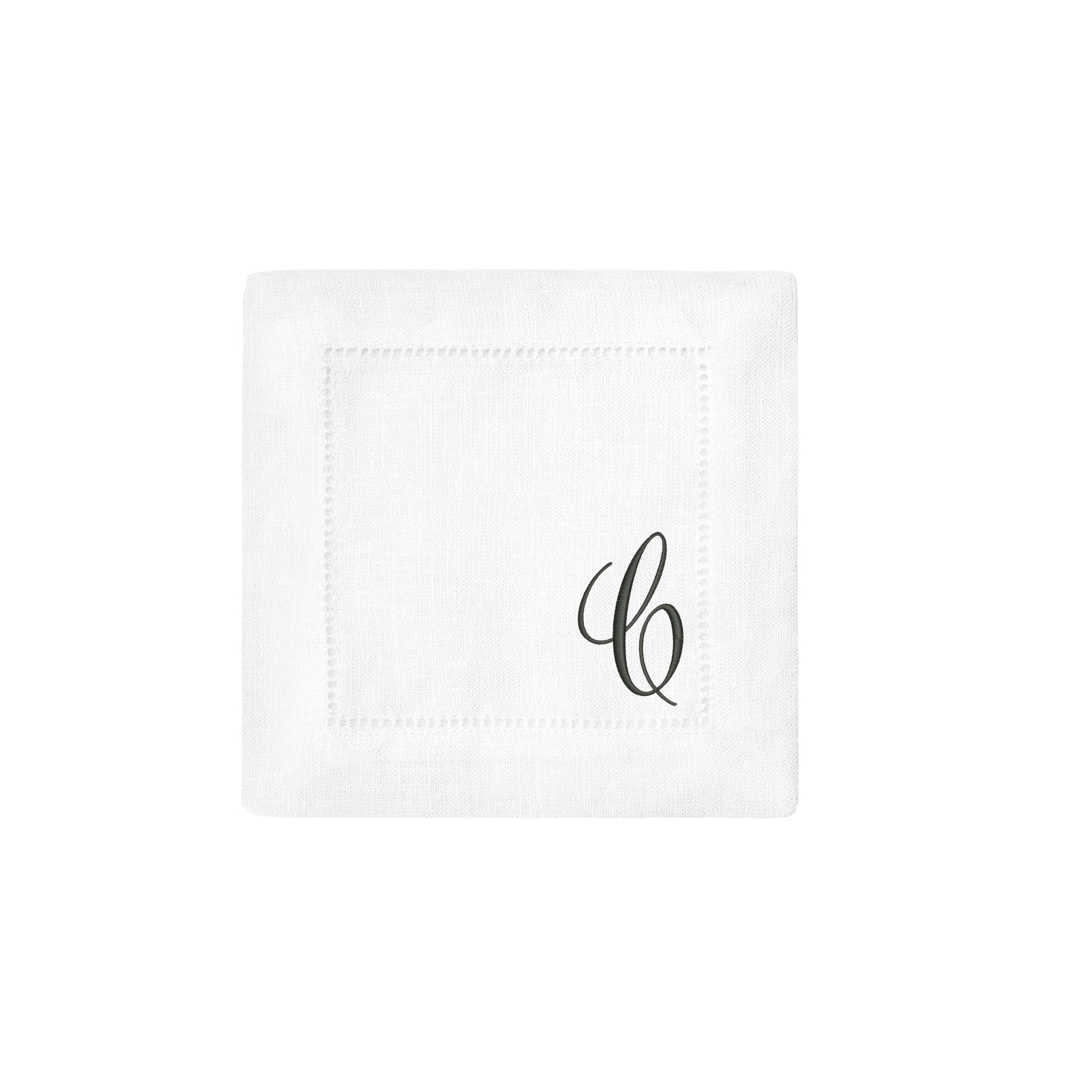 Elegant white linen napkin with embroidered initials, perfect for special occasions or everyday dining.