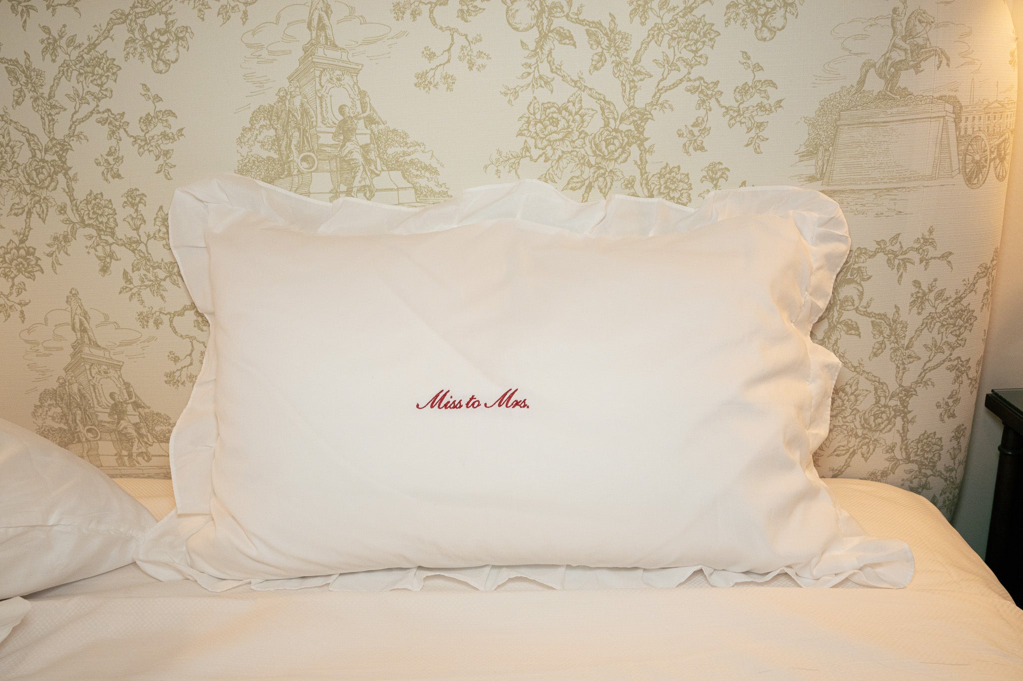 White ruffled pillowcase with 'Miss to Mrs.' embroidery, perfect for weddings and bridal decor.