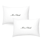 Set of white pillowcases with elegant 'Mr. Clark' and 'Mrs. Clark' embroidery, perfect for couples.