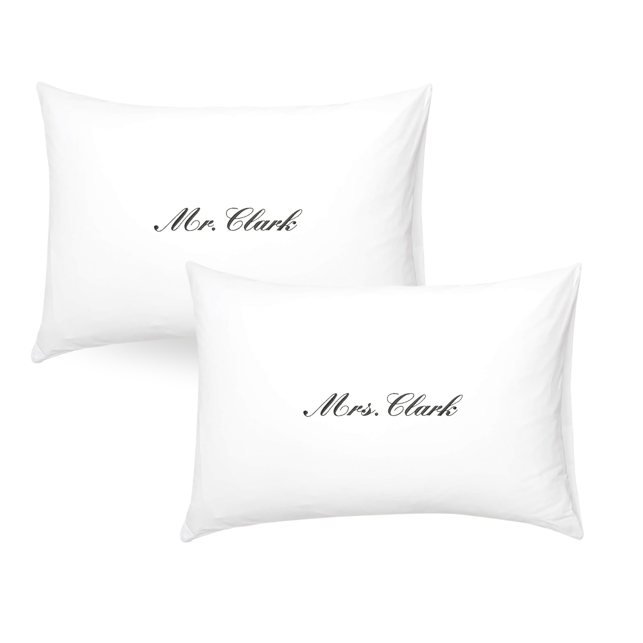 Set of white pillowcases with elegant 'Mr. Clark' and 'Mrs. Clark' embroidery, perfect for couples.
