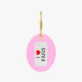 Fun pink keychain with 'I Love Paris' design, featuring a gold-tone hook and soft fabric material.