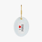 I Love Paris keychain, oval shape, white fabric, gold metal clasp, perfect travel accessory.