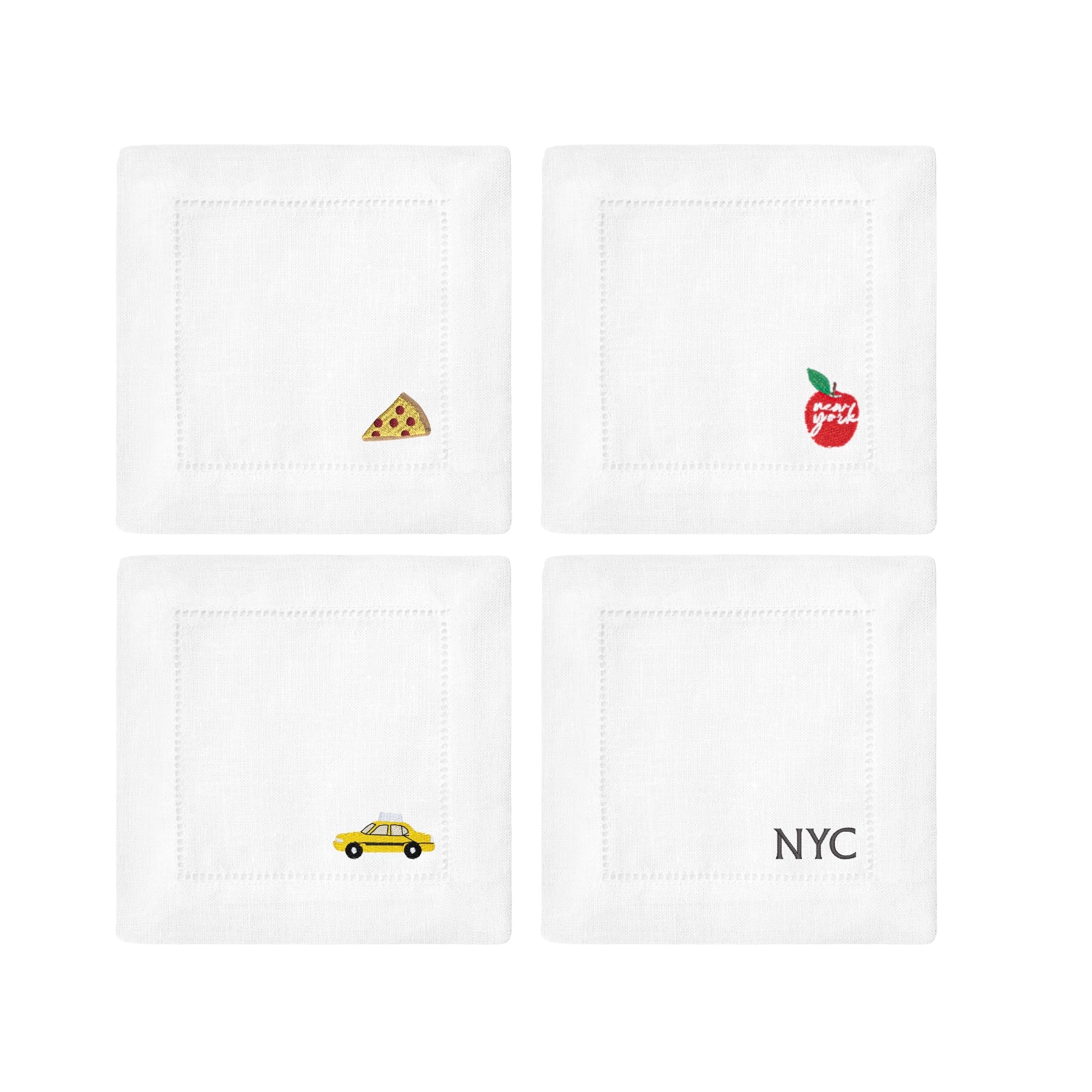 Set of four white linen coasters featuring NYC-themed embroidery: pizza, apple, taxi, and NYC text.
