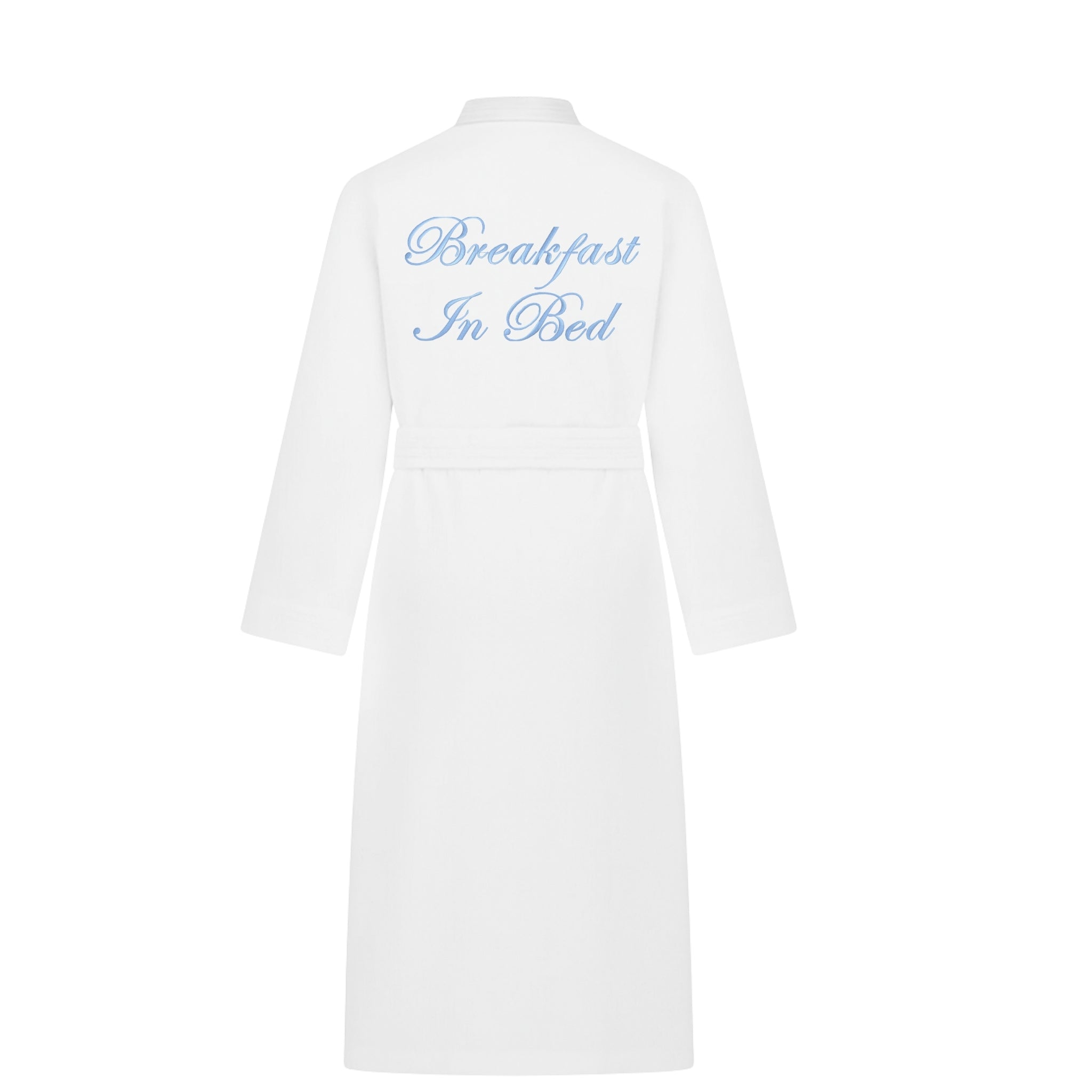 White bathrobe with 'Breakfast In Bed' embroidery, soft cotton fabric suitable for lounging.