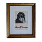 Framed embroidered portrait of a dog with a handkerchief, vintage style, elegant gold frame.