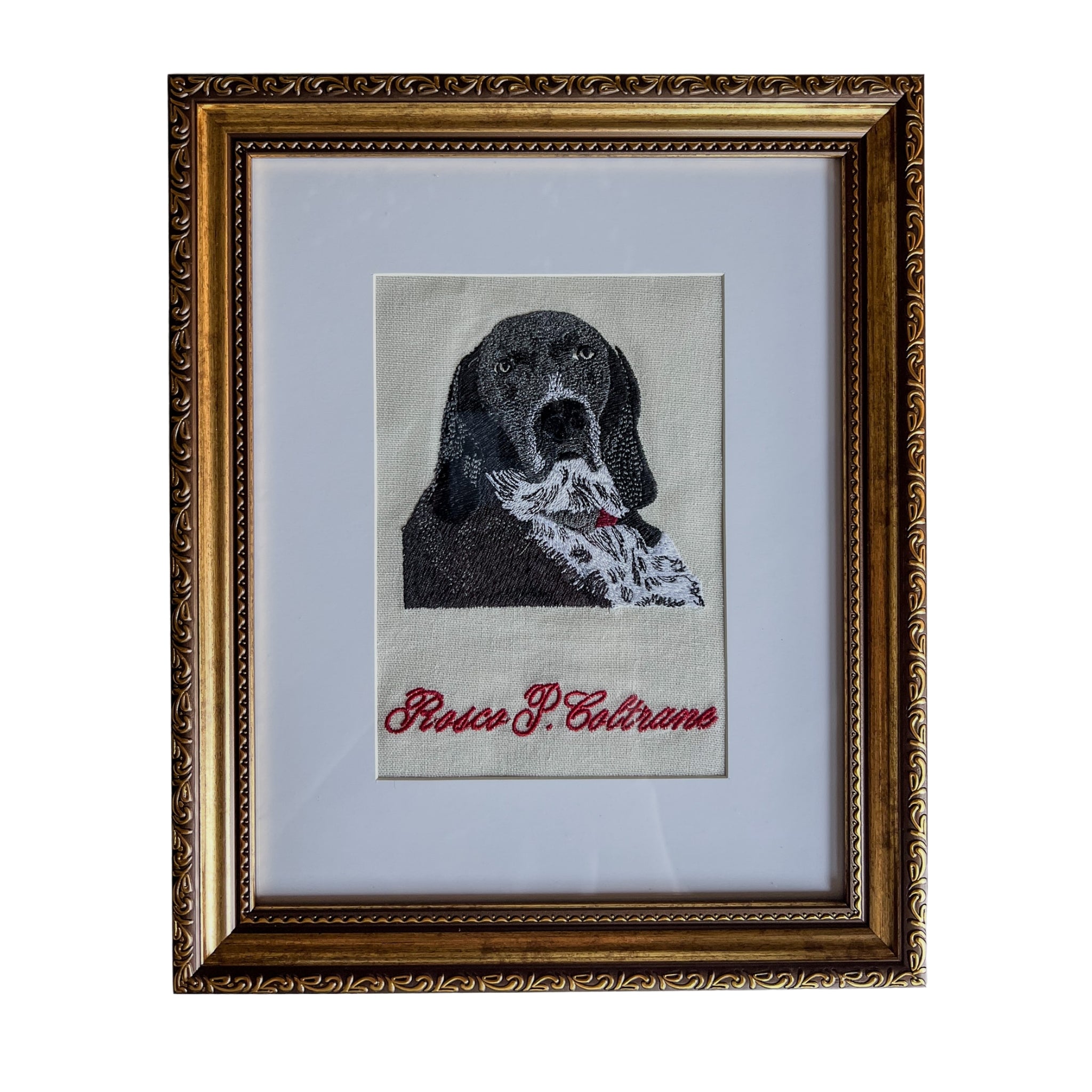 Framed embroidered portrait of a dog with a handkerchief, vintage style, elegant gold frame.