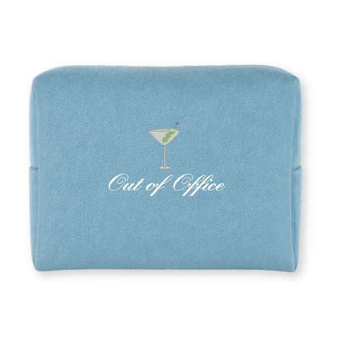Light blue canvas cosmetic bag with 'Out of Office' text and martini graphic.