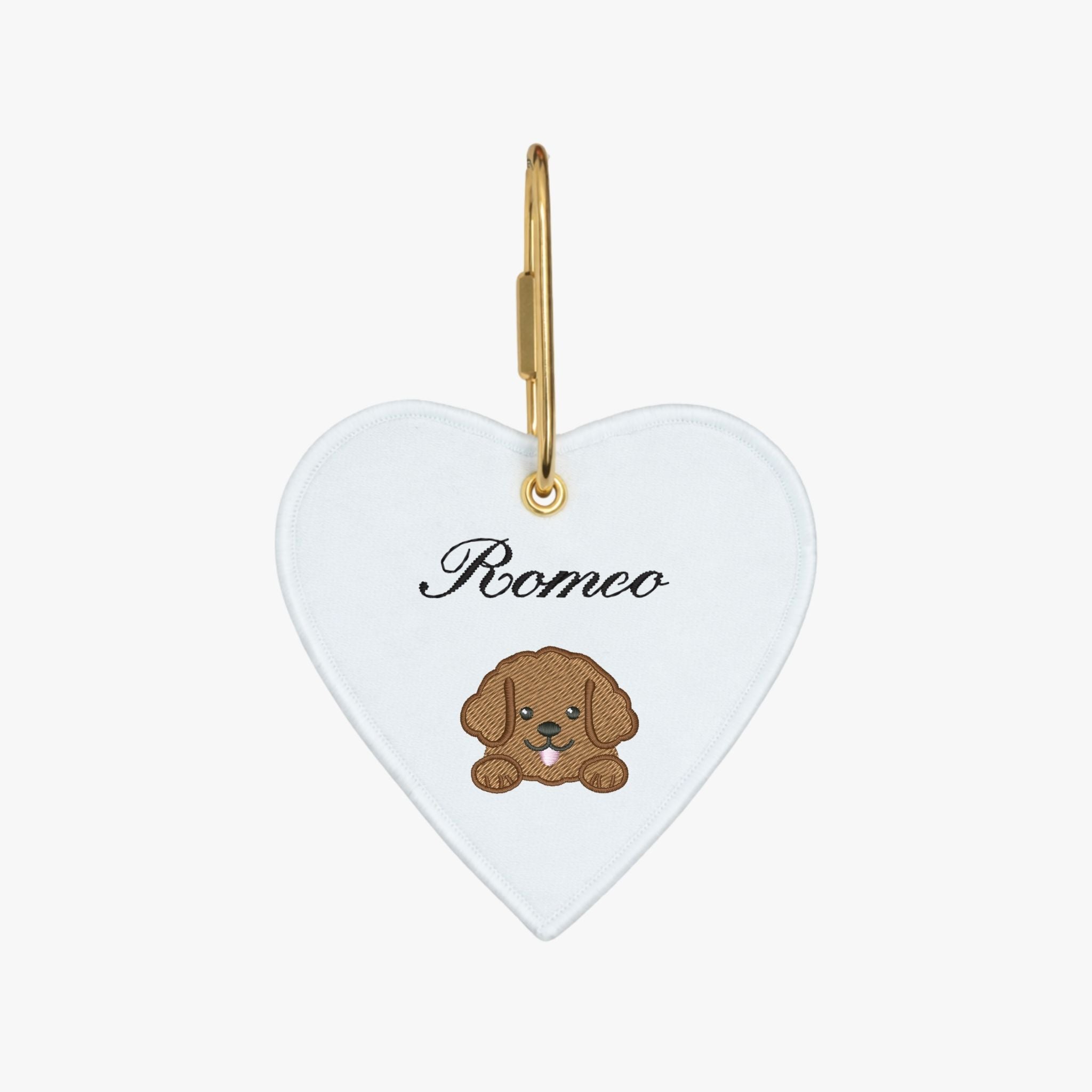 Heart-shaped dog tag, white fabric, cute puppy design, gold clasp, personalized with 'Romeo'