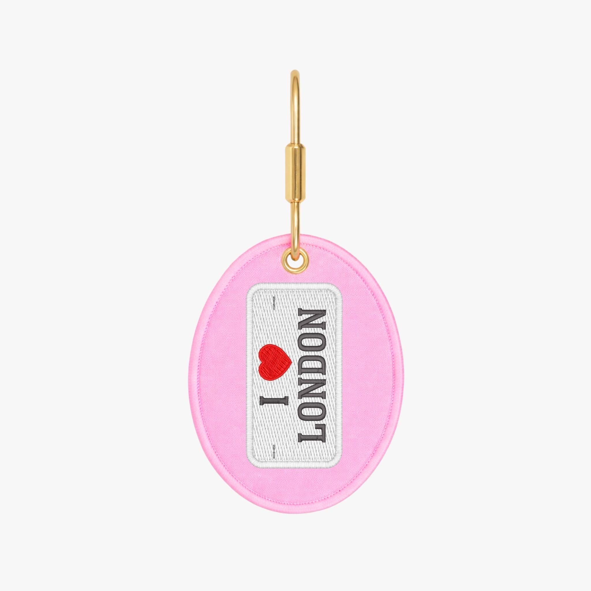 Pink 'I Love London' keychain with gold hardware, perfect for travel enthusiasts.
