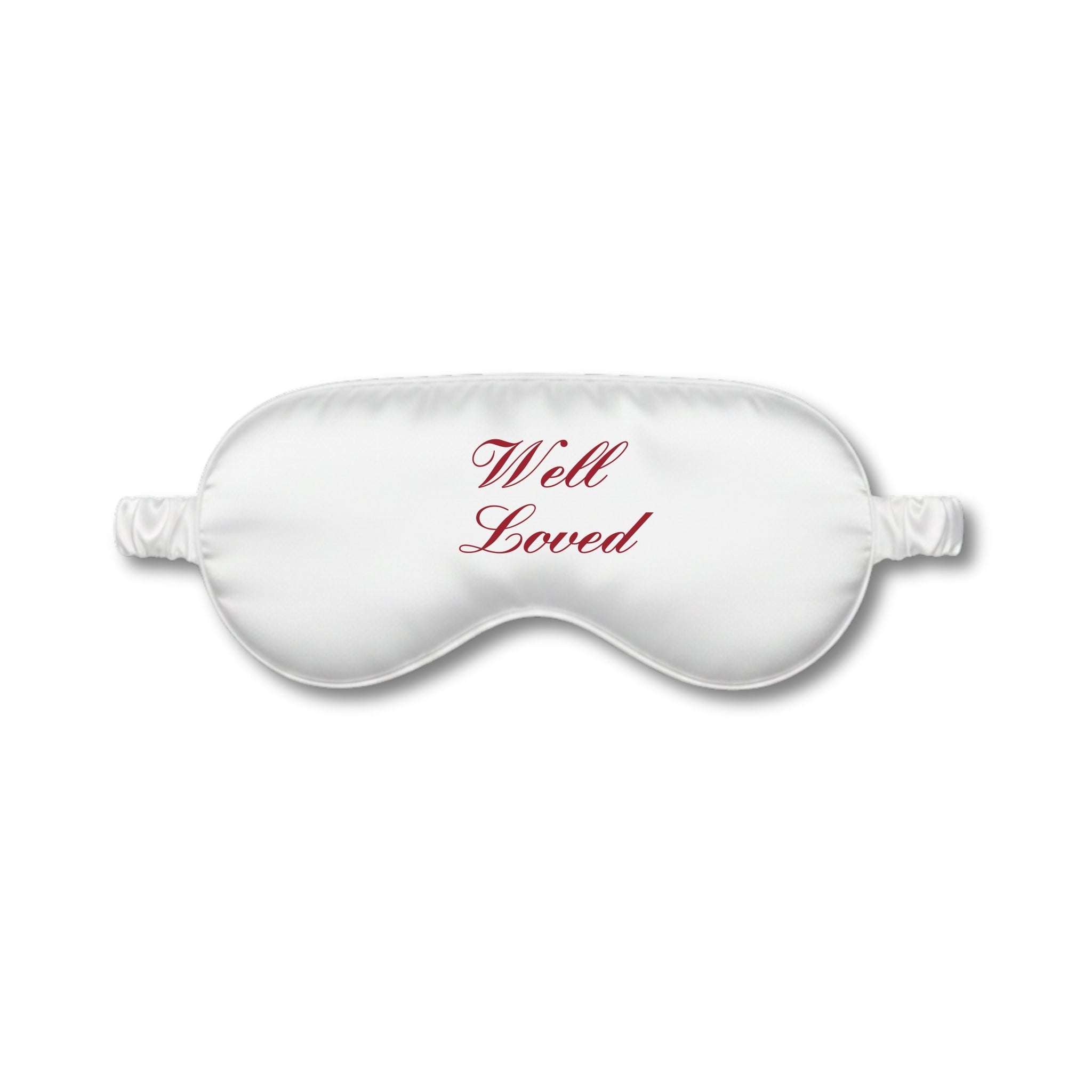 White sleep mask with 'Well Loved' text on a white background