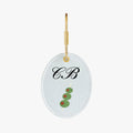 Personalized monogram keychain featuring green olives on a skewer, gold-tone hardware, and white background.
